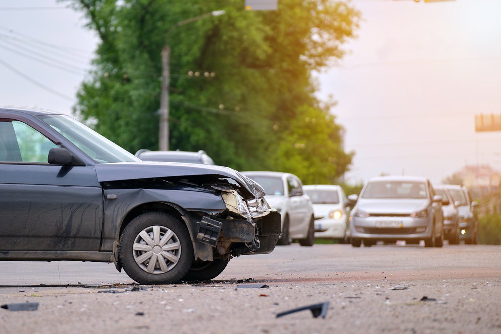 Front-end vehicle damage after a car accident in Anaheim where an injured driver may need legal help with an insurance claim.
