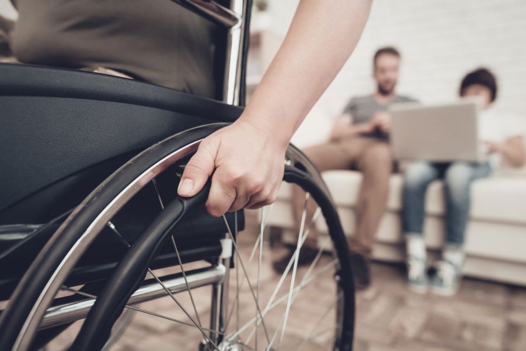Personal Injury Lawyer Anaheim, CA - Disabled Soldier In A Wheelchair. Disability Problem. After War Concept. Camouflage Uniform. Paralyzed Woman. Home Leisure. Return From Army. Hands On Wheels. Family Background. Husband And Son.