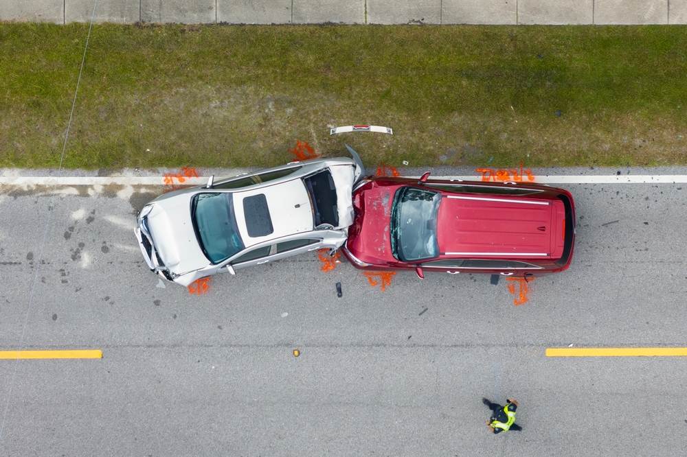 Aerial view of Anaheim car accident scene with vehicle damage and first responder