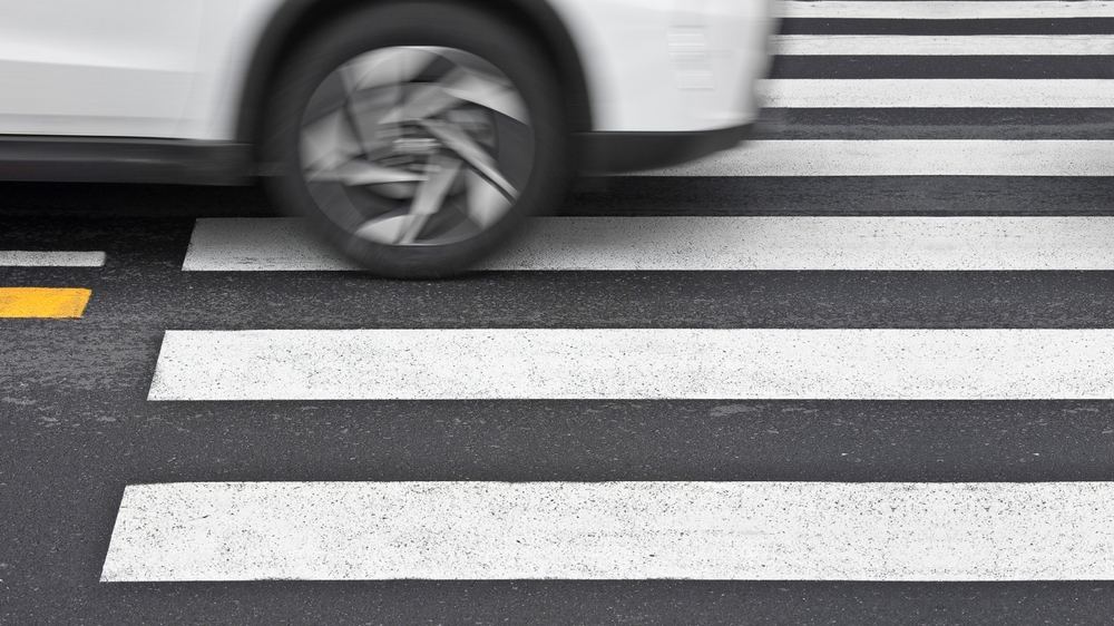 Car crossing crosswalk lines, a common cause of Anaheim pedestrian accidents