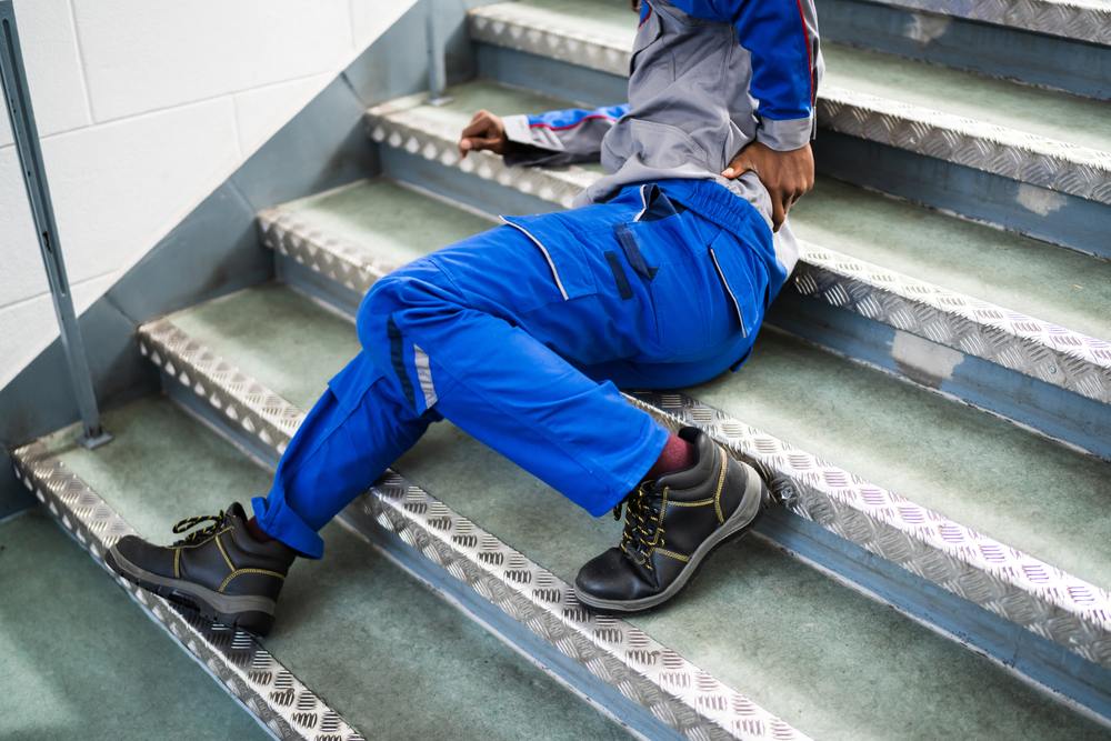 Worker fallen on a metal staircase after a slip and fall accident in Los Angeles