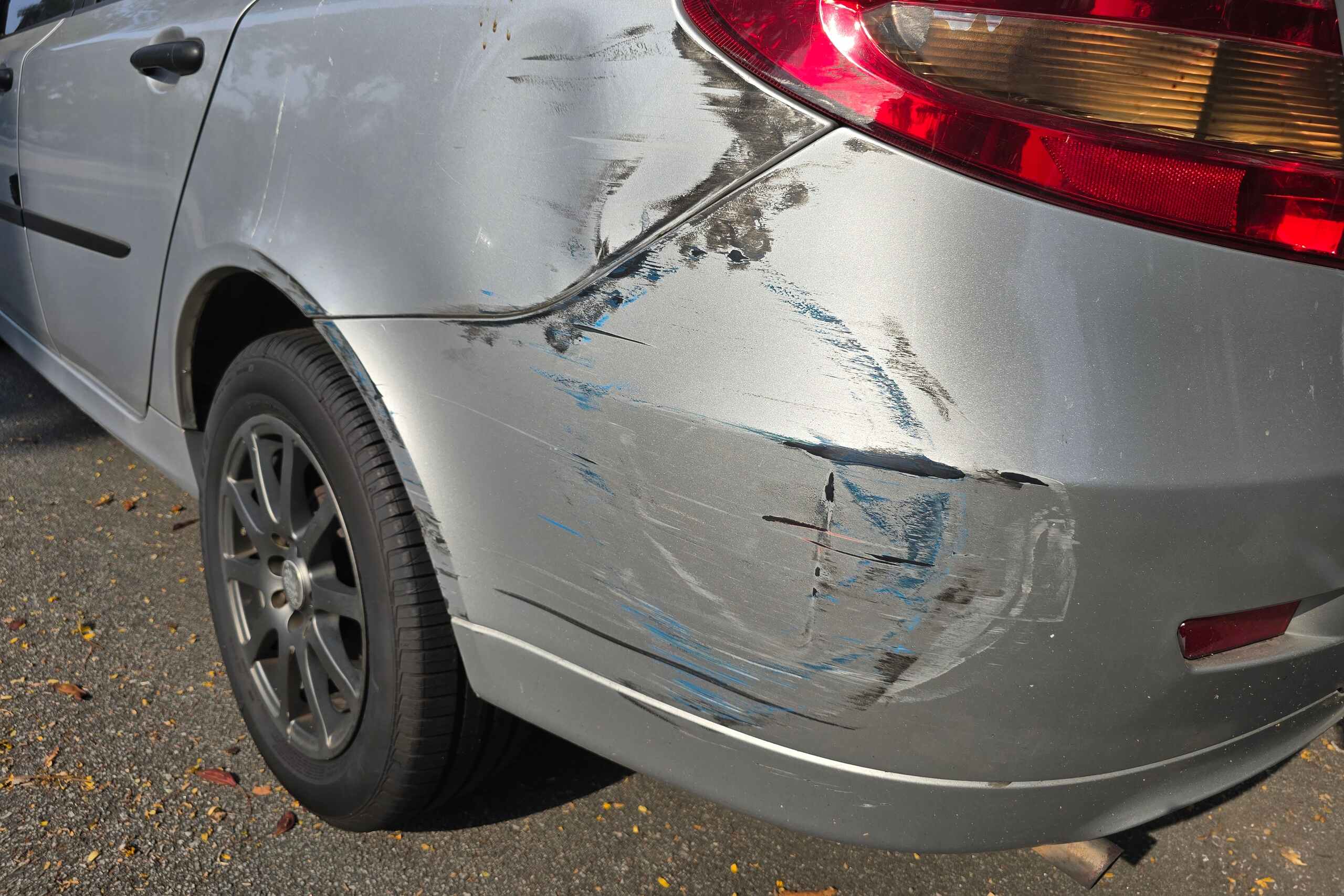Damaged rear bumper of a silver car involved in a collision handled by Anaheim hit and run accident lawyers.