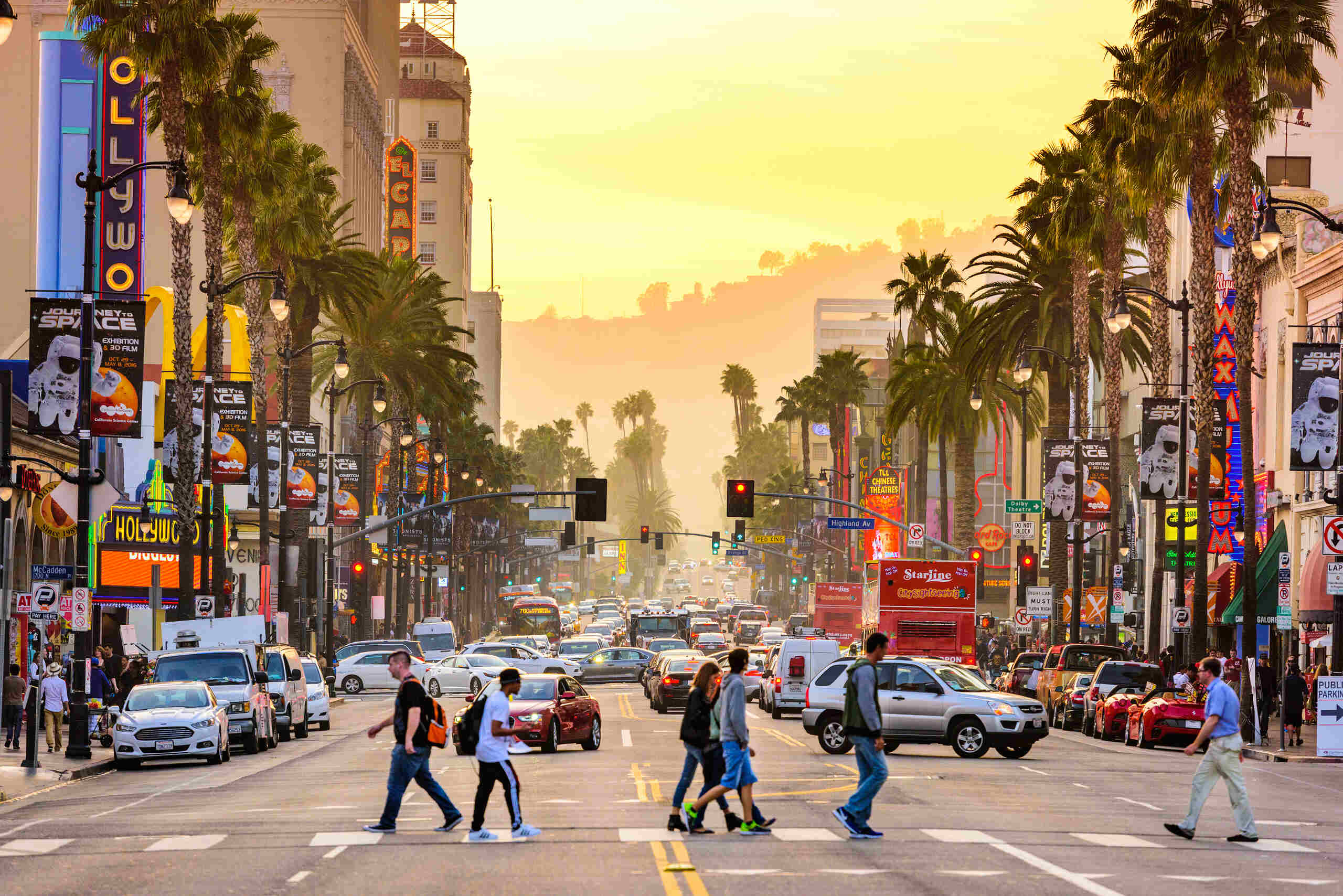 People crossing Hollywood Boulevard traffic where victims seek guidance from experienced Los Angeles pedestrian accident attorneys.
