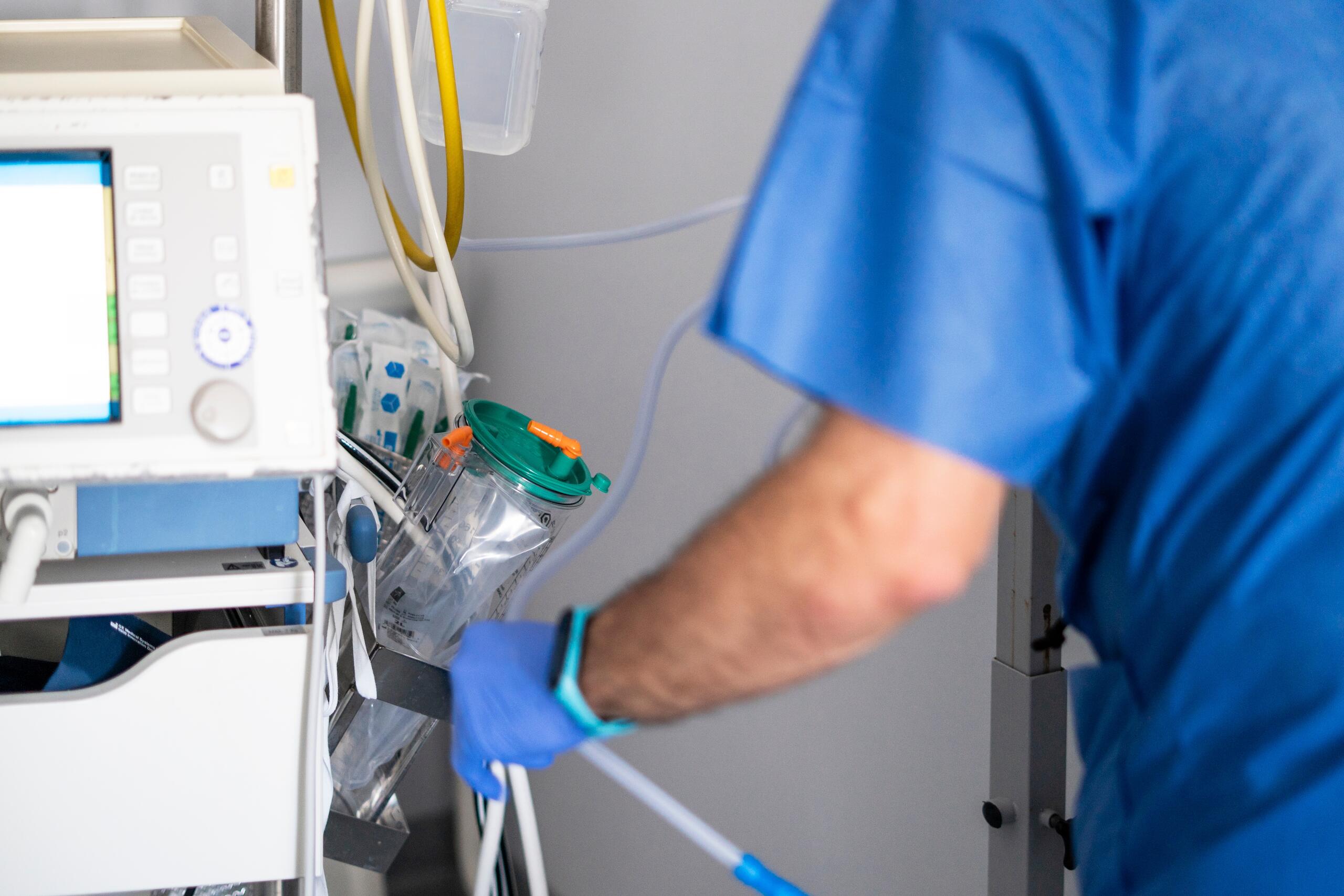 A healthcare professional operates hospital equipment involved in a medical error case evaluated by Los Angeles wrongful death attorneys.
