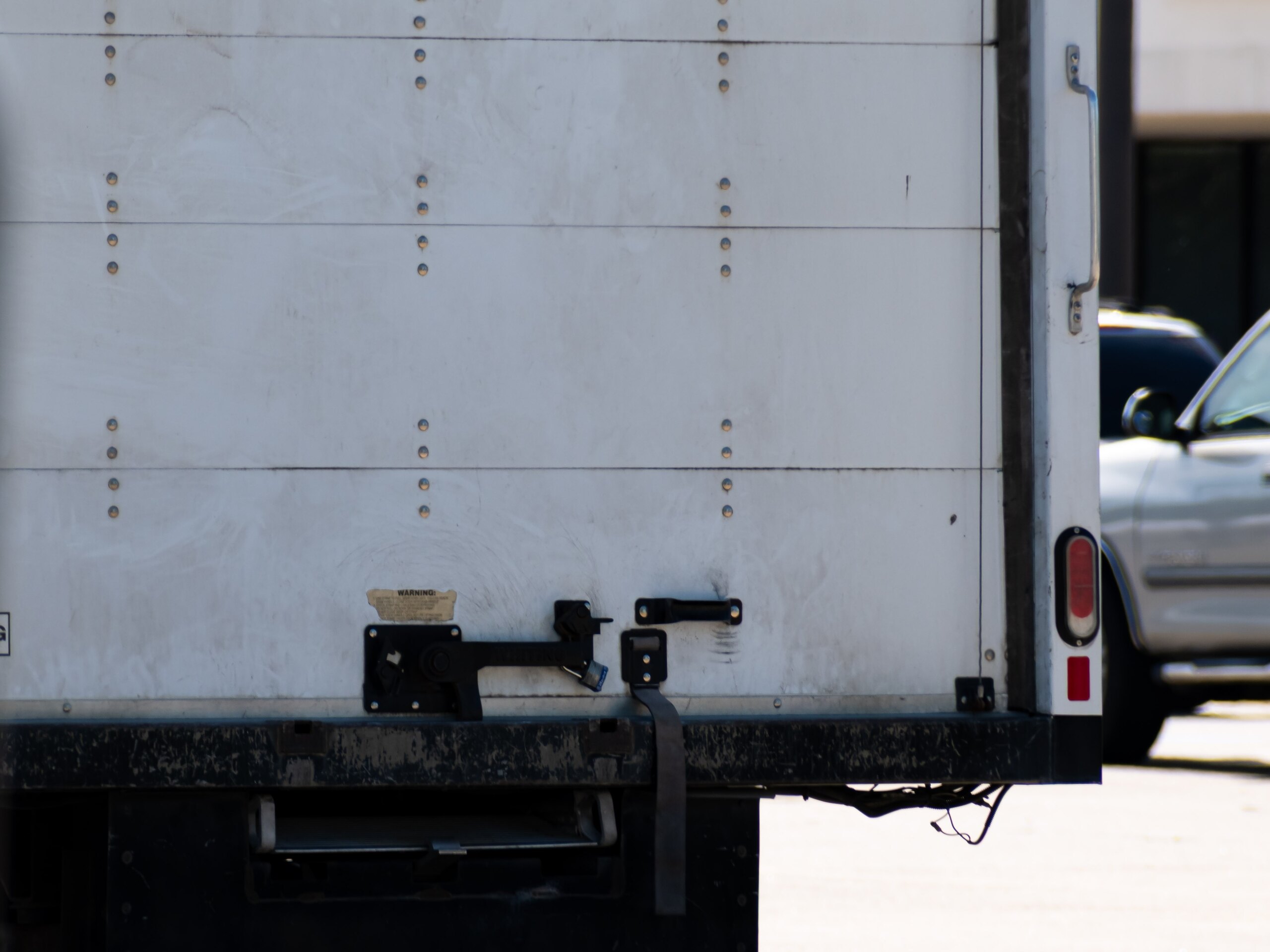 Rear door of a commercial box truck involved in a collision handled by Burbank truck accident lawyers.